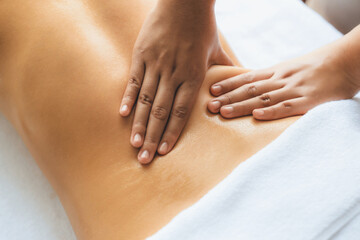 Closeup woman customer enjoying relaxing anti-stress spa massage and pampering with beauty skin...
