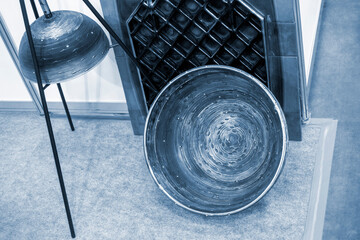 Objects printed on 3D printer from filament of molten metal. Object printed by 3D printer from metal. Additive manufacturing solution. Round object created on 3D printer from melting metal thread