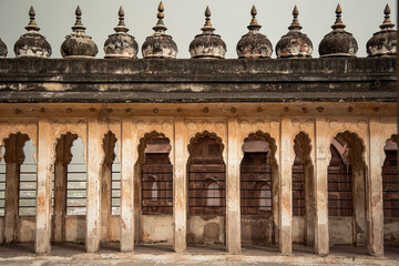 Fototapeta premium Ancient arches and domes adorning rooftop of historic building in Udaipur, India