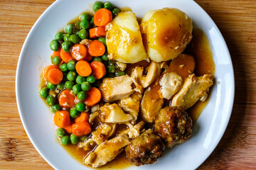 Traditional British Favourite Roast Chicken Sunday Meal With Vegetables And Stuffing