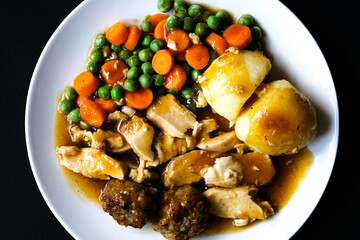 Traditional British Favourite Roast Chicken Sunday Meal With Vegetables And Stuffing