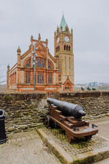 Historic cannons are positioned atop the ancient Londonderry City Walls, offering a glimpse into...
