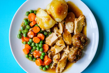 Traditional British Favourite Roast Chicken Sunday Meal With Vegetables And Stuffing