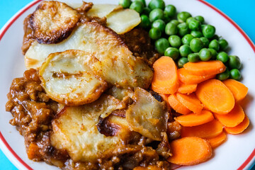 Traditional British Favourite Beef Hotpot With Carrots and Peas