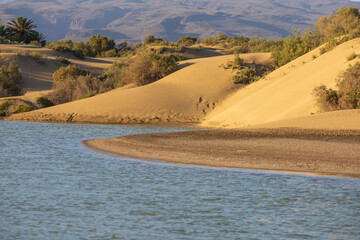 Seascape and dunes at Faro de Maspalomas on Gran Canaria, Spain