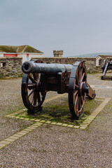 Historic cannons are positioned atop the ancient Londonderry City Walls, offering a glimpse into...