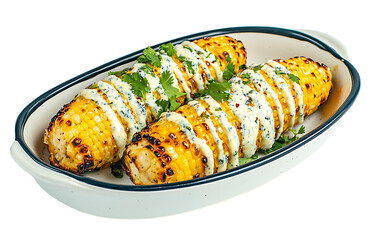 Grilled corn on the cob with creamy cilantro sauce.