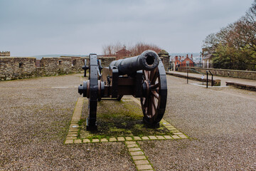 Historic cannons are positioned atop the ancient Londonderry City Walls, offering a glimpse into the city's past and providing panoramic views of the surrounding area