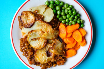 Traditional British Favourite Beef Hotpot With Carrots and Peas