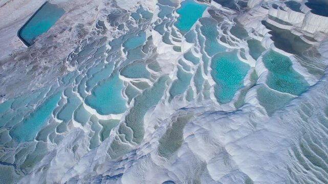Aerial view Natural travertine pools Pamukkale Turkish, spa terraces with blue water.