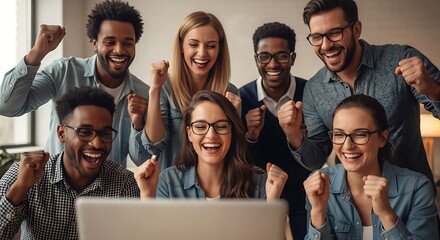 Excited diverse team celebrates success on laptop screen
