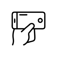 Fototapeta premium Hand holding smartphone for taking selfie in minimalist style 