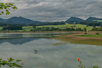 Cloudy morning sunrise with water of lake Wallersee Austria