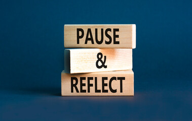 Pause and reflect symbol. Concept words Pause and reflect on beautiful block. Beautiful grey table grey background. Business motivational lifestyle pause and reflect concept. Copy space.