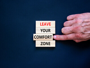 Leave your comfort zone symbol. Concept words Leave your comfort zone on beautiful wooden blocks. Beautiful black paper background. Business psychological Leave your comfort zone concept. Copy space.