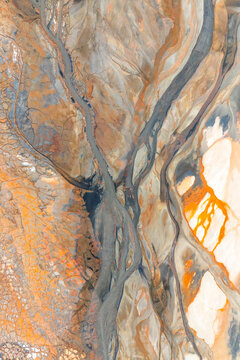 Abstract aerial view of river landscape exhibiting patterns