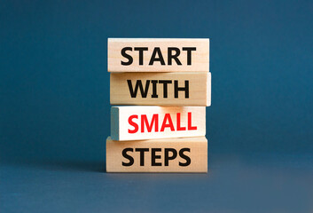 Start with small steps symbol. Concept words phrase Start with small steps on beautiful wooden...