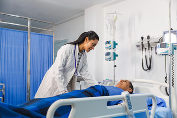 Female doctor caring for an elder patient in hospital