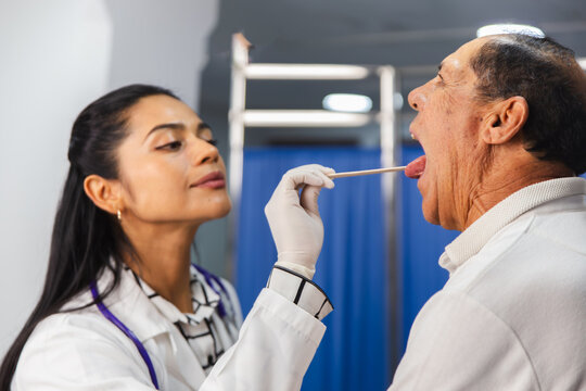 Medical examination of elderly patient by female doctor
