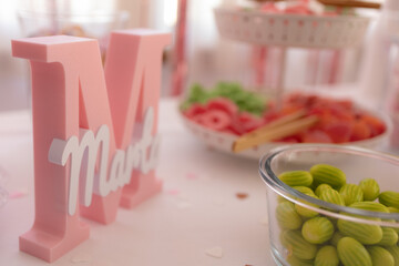 Pink wooden letter m decorated table for birthday party celebration