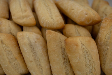 Freshly baked crusty bread rolls forming an appetising pattern
