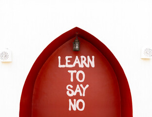 Learn to say no symbol. Concept words phrase Learn to say no on beautiful brown wall. Beautiful...
