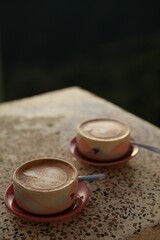 Aromatic coffee served on light table, closeup