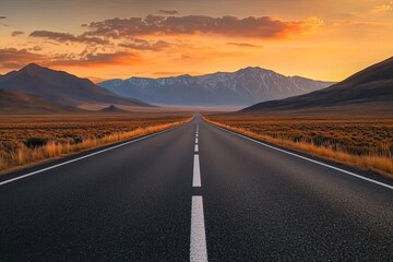 Naklejka premium Open road stretching into a mountain sunset