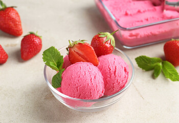 Tasty sorbet with strawberries and mint served on light table, closeup