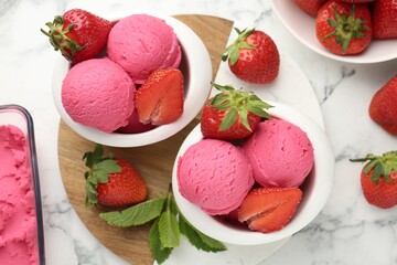 Refreshing sorbet, strawberries and mint on white marble table, flat lay
