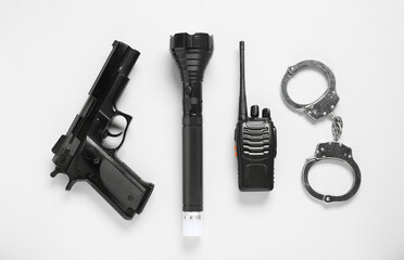Different police equipment on white background, flat lay