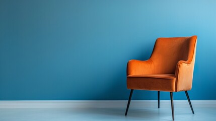 Orange chair on minimal blue wall with shadow in modern interior concept elegant contemporary furniture style