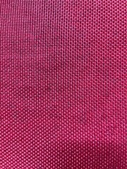 Crimson Texture: A close-up view showcases a detailed, textured pattern of a crimson fabric. The even lighting enhances the intricate design, creating a visually captivating surface. 