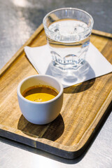 Freshly brewed espresso served in a small cup on a table