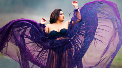 Woman in purple dress overlayed with astral photo