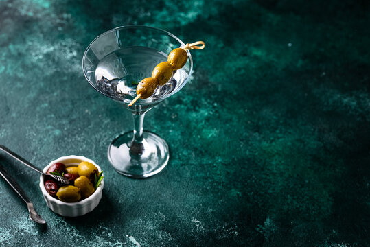 Traditional martini cocktail with olives and - Powered by Adobe