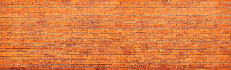 Orange brick wall forming a seamless background texture