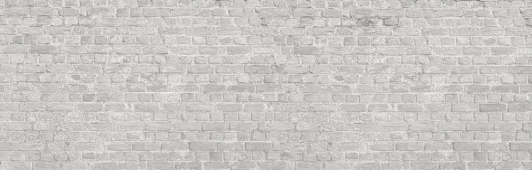 White brick wall forming textured background with light gray mortar