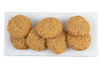 Homemade oatmeal cookies with nuts on white background, close-up view