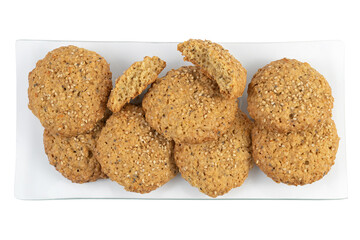 Homemade oatmeal cookies with nuts on white background, close-up view
