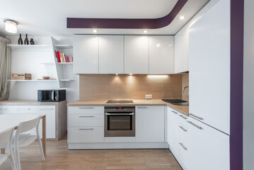 Fototapeta premium Modern Home White Kitchen Interior With Minimalistic Design and Wooden Floor Details