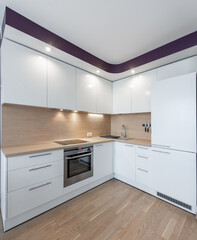 Modern Home White Kitchen Interior With Minimalistic Design and Wooden Floor Details