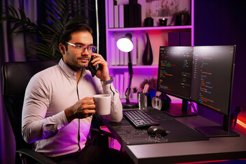 Smart IT developer calling to coworker with holding coffee cup solving error software development...