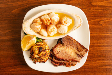 Sautéed scallops, crab cake and brisket