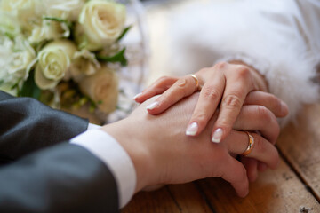 Bride and Groom Holding Hands at Wedding