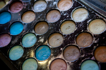 Dirty makeup palette with various colors