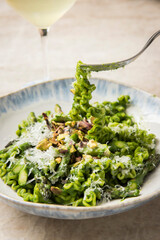 Fresh green pasta with asparagus spears & parmesan cheese. Spring vegetable pasta dish with pesto...