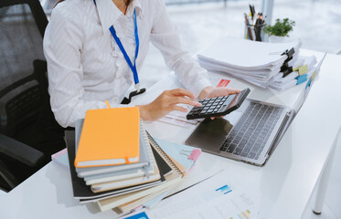 Accountant Calculating Finances at Desk