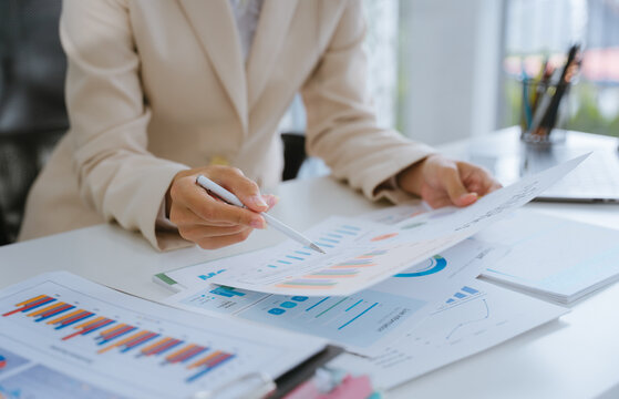 Businesswoman Analyzing Financial Data Charts