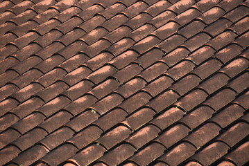 Red roof with colonial-style tiles.